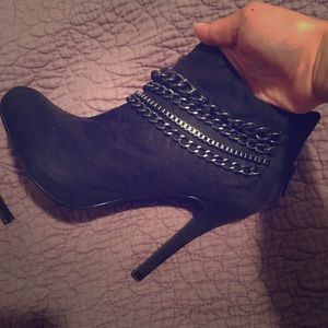 Black ankle booties with mixed media chains